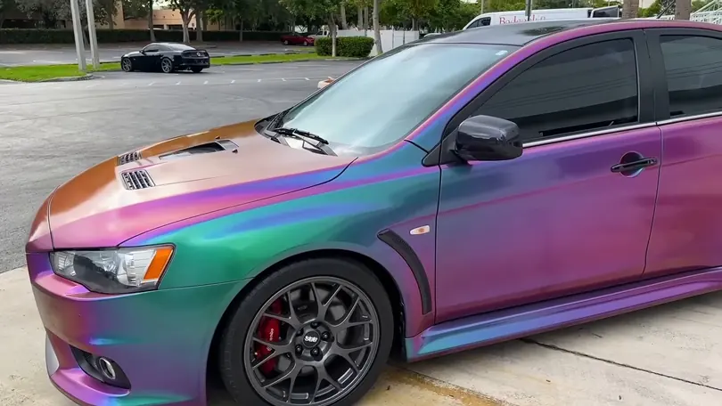 A Lancer Evolution in a chameleon finish, copper on the hood and violet and green down the side